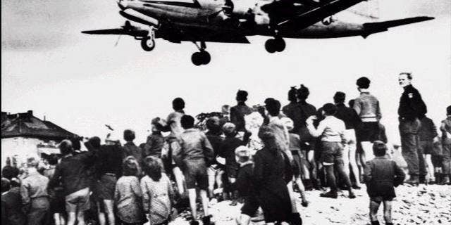 U.S. Air Force C-54 Skymaster aircraft lands at Berlin Tempelhof Airport during the Berlin Airlift, June 6, 1948. The Berlin Airlift was prompted by the Soviet's Berlin Blockade, one of the first international crises of the Cold War.