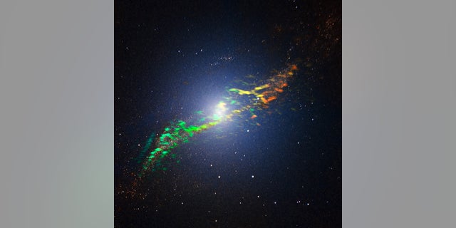 This new image of Centaurus A combines ALMA and near-infrared observations of the massive elliptical radio galaxy. The new ALMA observations, shown in a range of green, yellow and orange colours, reveal the position and motion of the clouds of gas in the galaxy. They are the sharpest and most sensitive such observations ever made. ALMA was tuned to detect signals with a wavelength around 1.3 millimetres, emitted by molecules of carbon monoxide gas. The motion of the gas in the galaxy causes slight changes to this wavelength, due to the Doppler effect. The motion is shown in this image as changes in colour. Greener features trace gas coming towards us while more orange features depict gas moving away. We can see that the gas to the left of the centre is moving towards us, while the gas to the right of the centre is moving away from us, indicating that the gas is orbiting around the galaxy. The ALMA observations are overlaid on a near-infrared image of Centaurus A obtained with the SOFI instrument attached to the ESO New Technology Telescope (NTT).