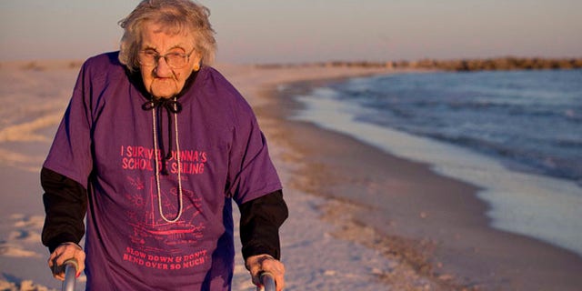 Nov. 19, 2014: Ruby Holt, a 100-year-old Tennessee native, walks on the beach for the first time in her life in Orange Beach, Ala. (AP)