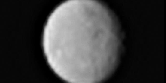 This processed image, taken Jan. 13, 2015, shows the dwarf planet Ceres as seen from the Dawn spacecraft. The image hints at craters on the surface of Ceres. Dawn's framing camera took this image at 238,000 miles from Ceres.