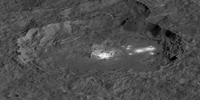 A view of the bright spots of the dwaf planet Ceres' Occator Crater. Cerealia Facula lies in the middle, while Vinalia Faculae is off to the right.