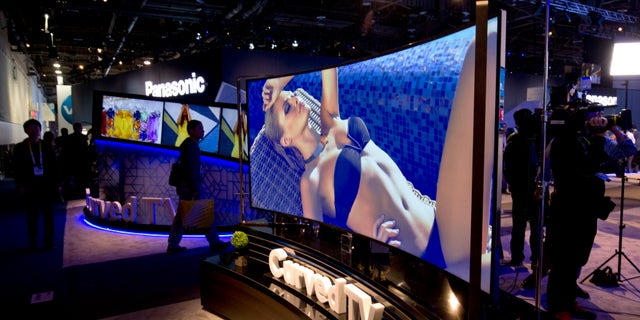 A 105-inch, curved 5K LED TV by Haier is displayed during the 2015 International Consumer Electronics Show (CES) in Las Vegas, Nevada January 6, 2015. REUTERS/Steve Marcus (UNITED STATES - Tags: SCIENCE TECHNOLOGY BUSINESS) - RTR4KANN