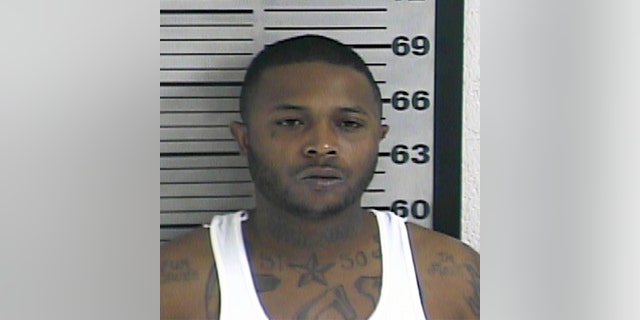 In this photo made available by the Dyer County Sheriff's Office, Tenn., on Friday, Nov. 18, 2016, shows Torius Russell under arrest. Authorities accuse Russell of fatally shooting the mother of a 2-year-old during the child's birthday party in Dyersburg, Tenn., Thursday, Nov. 17, 2016. (Dyer County Sheriff's Office via AP)