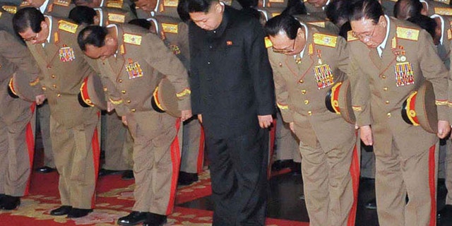 Dec. 24, 2011: This photo released by the Korean Central News Agency and distributed by the Korea News Service, shows Kim Jong Un, center.