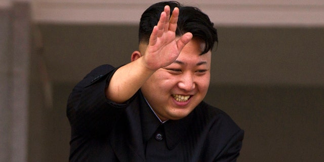 July 27, 2013: In this file photo, North Korean leader Kim Jong Un leans over a balcony and waves to Korean War veterans cheering below at the end of a mass military parade on Kim Il Sung Square in Pyongyang to mark the 60th anniversary of the Korean War armistice.