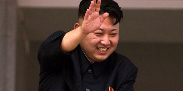 July 27, 2013: In this file photo, North Korean leader Kim Jong Un leans over a balcony and waves to Korean War veterans cheering below at the end of a mass military parade on Kim Il Sung Square in Pyongyang to mark the 60th anniversary of the Korean War armistice.