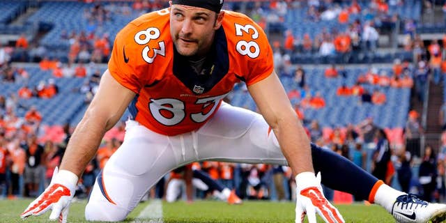 FILE - In this Aug. 23, 2014, file photo, Denver Broncos wide receiver Wes Welker (83) stretches prior to an NFL preseason football game against the Houston Texans in Denver. The Broncos will be without Welker for the first four games of the season after the NFL said the receiver violated the league's performance-enhancing drug policy. Normally, the league announces such violations on Monday. News of Welker's ban didn't come down until late Tuesday, Sept. 2, 2014, after the league offices had closed and the Broncos had already finished drawing up blueprints for their opener against Indianapolis, undoubtedly with Welker playing a prominent role.(AP Photo/Jack Dempsey, File)