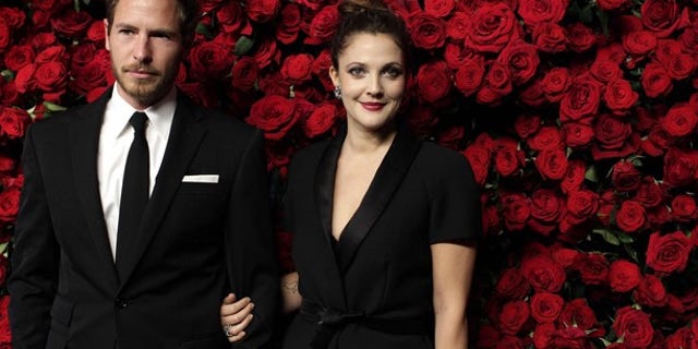 Nov. 15: Actress Drew Barrymore (R) and Will Kopelman (L) attend the Museum of Modern Art's fourth annual Film Benefit in New York. (REUTERS)