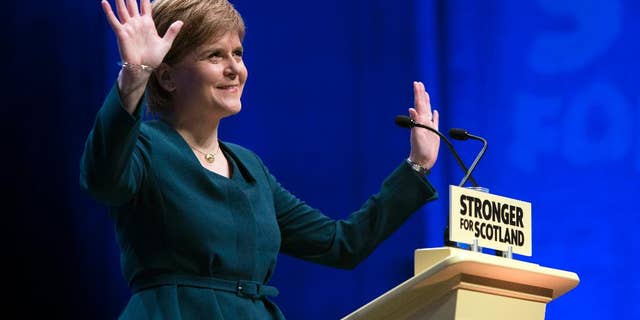 First Minister of Scotland and the leader of the Scottish National Party Nicola Sturgeon, at the start of the SNP's biggest-ever conference, in Glasgow, Scotland, Thursday, Oct. 13, 2016. Scotland's leader says she will publish a bill next week laying the groundwork for a new independence referendum — the first step toward a new vote on whether Scotland should leave the United Kingdom. (John Linton/PA via AP)