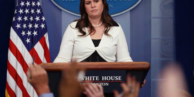 White House deputy press secretary Sarah Huckabee Sanders addresses reporters. Audio and video recordings have been prohibited at daily briefings since June 29.