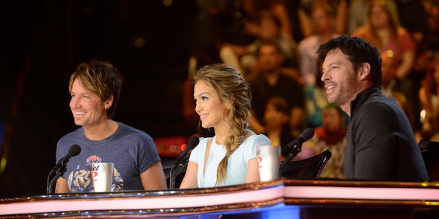 AMERICAN IDOL XIII: L-R: Keith Urban, Jennifer Lopez and Harry Connick, Jr. on AMERICAN IDOL XIII airing Wednesday, March 19 (8:00-10:00 PM ET / PT) on FOX. CR: Michael Becker / FOX. Copyright 2014 / FOX Broadcasting.