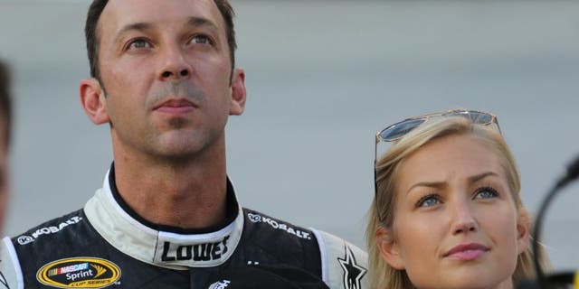 USA -Aug 23: NASCAR Sprint Cup Series crew chief Chad Knaus and his girlfriend Brooke Werner stand on pit road during the National Anthem prior to the start of the NASCAR Sprint Cup Series Irwin Tools Night Race at the Bristol Motor Speedway in Bristol, TN. Picture taken on Aug 23, 2014 in the United States. (Photo by Jim Fluharty/NASCAR Illustrated/Sporting News via Getty Images)