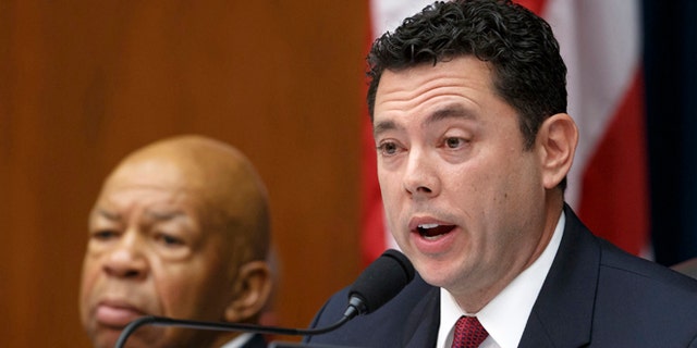 In this Sept. 30, 2014 file photo, Rep. Jason Chaffetz, R-Utah, accompanied by Rep. Elijah Cummings, D-Md., speaks on Capitol Hill in Washington.