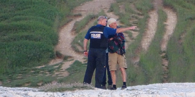Police arrived to warn tourists to steer clear of the cliff's edge.