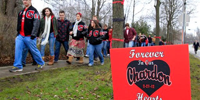 March 1, 2012: Students and parents march to Chardon High School in Chardon, Ohio, to honor the three students who were killed in a shooting there Monday.