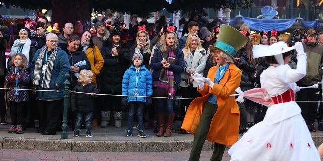 British soap stars Mark Wright and Michelle Keegan, center, turned up to meet the families at Disneyland Paris.