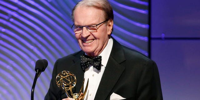 Executive producer Rand Morrison (L) and anchor Charles Osgood of "CBS Sunday Morning" accept the outstanding morning program award during the 40th annual Daytime Emmy Awards in Beverly Hills, California June 16, 2013. REUTERS/Danny Moloshok (UNITED STATES - Tags: ENTERTAINMENT) - RTX10QIY
