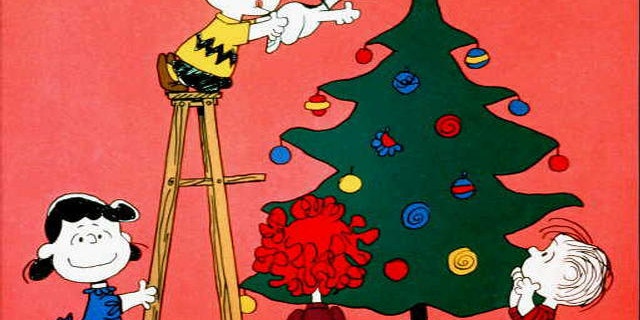 Lucy, Charlie Brown, Snoopy and Linus in scene from tv special "A Charlie Brown Christmas."