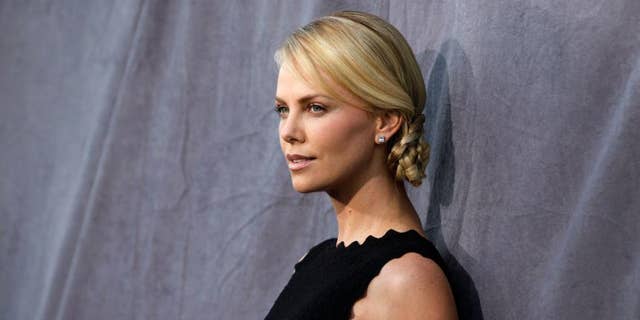 Harvey Weinstein denied through his rep that he slept with actresses Charlize Theron (pictured) and Gwyneth Paltrow.