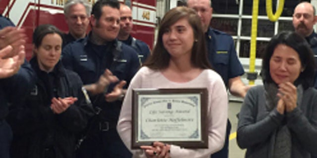 Charlotte Heffelmire with her Citizen Lifesaving Award
