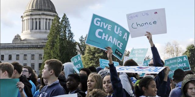 Students and other advocates of charter schools rally in Olympia, Wash., in November.