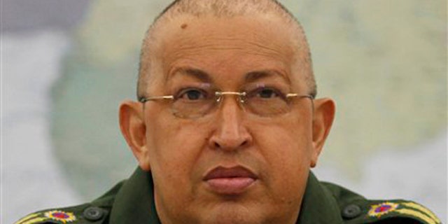 In this photo provided by Miraflores Presidential Press Office, Venezuela's President Hugo Chavez speaks during a meeting at Miraflores presidential palace in Caracas, Venezuela, Aug. 6. Chavez is shown after having undergone chemotherapy for cancer.