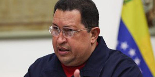 March 29, 2012: In this photo provided by the Miraflores Presidential Press Office, Venezuelan President Hugo Chavez, center, during a meeting with ministers.