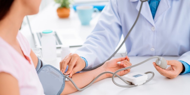 checking blood pressure istock large