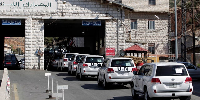 Oct. 1, 2013: A convoy of inspectors from the Organization for the Prohibition of Chemical Weapons prepares cross into Syria at the Lebanese border crossing point of Masnaa, eastern Bekaa Valley, Lebanon.
