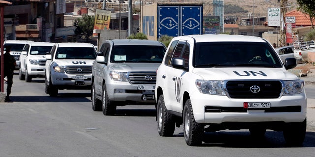 Oct. 1, 2013: A convoy of inspectors from the Organization for the Prohibition of Chemical Weapons prepares to cross into Syria at the Lebanese border crossing point of Masnaa, eastern Bekaa Valley, Lebanon. An advance group of 20 inspectors from a Netherlands-based chemical weapons watchdog arrived in Syria on Tuesday to begin their complex mission of finding, dismantling and ultimately destroying an estimated 1,000-ton chemical arsenal.