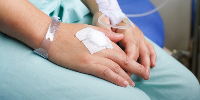 woman patient in hospital with saline intravenous (iv)