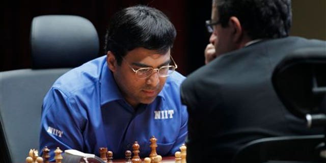 May 30, 2012: World Chess champion Viswanathan Anand from India, contemplates his next move during a match against Boris Gelfand of Israel at the FIDE World Chess Championship tie break match at Moscow's Tretyakovsky State Gallery, Russia.