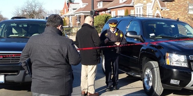Chicago police at the scene where six people were found dead Thursday afternoon.