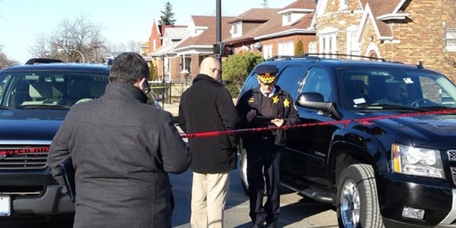 Chicago police at the scene where six people were found dead Thursday afternoon.