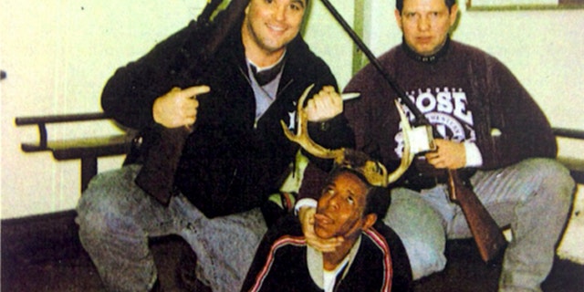 Officers Jerome Finnigan, left, and Tim McDermott with unidentified man