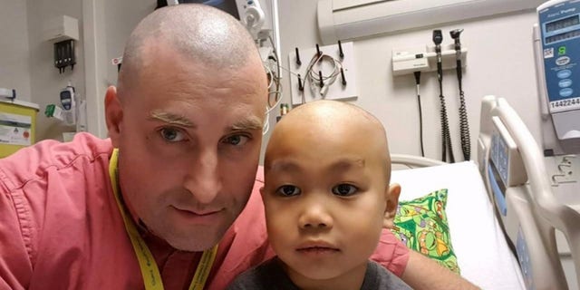 Jason and Joshua are pictured ahead of his treatment.