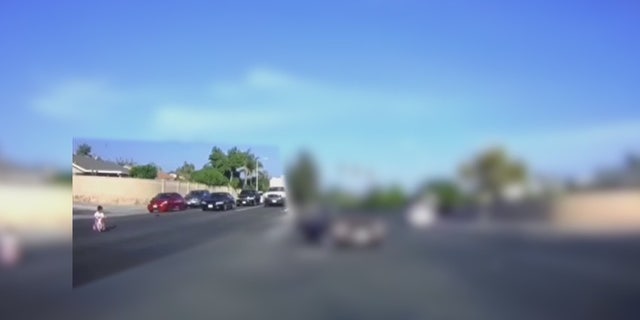 The child was "determined to go into the middle of the road," according to Sarah Tran, who witnessed the incident.