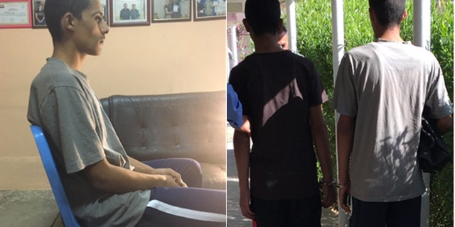 Mostafa Qais Ahmed Dawood, (l.), sits while being interrogated by Kurdish police. At right, he and Awad Arkan Helal Mohammed, 14, walk outside the police station, under heavy supervision.