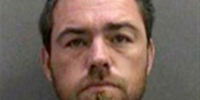 In this booking photo released by the Orange County Sheriff's Dept. on Monday Aug. 29, 2011 showing Sloan Briles, 35 who was arrested Sunday Aug. 28, 2011 for investigation of child endangerment and resisting arrest. Sloan was arrested for allegedly throwing his 7-year-old son overboard a Southern California sightseeing cruise during an argument.