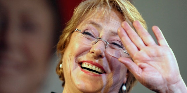 Former President Michelle Bachelet waves to supporters after winning presidential primaries in Santiago, Chile, Sunday June 30, 2013.