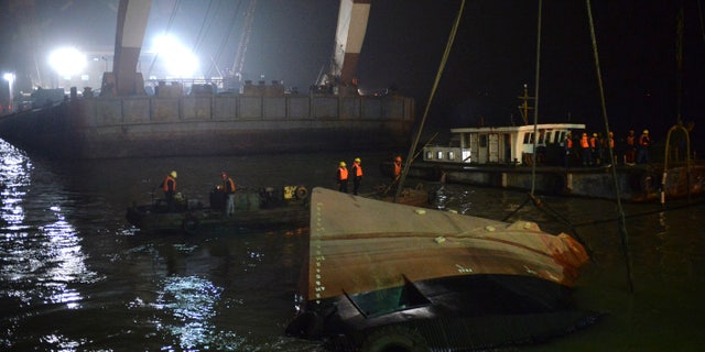Jan. 16, 2015: Rescuers salvage the wreck after a tug boat sank in the Yangtze River in east China's Jiangsu Province.