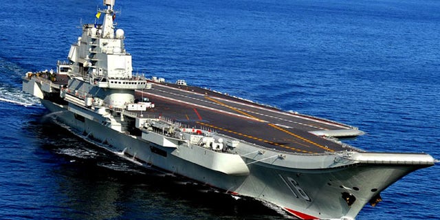 In this Oct. 14, 2012 photo, the Liaoning, China's first aircraft carrier, sails in the sea near Qingdao in eastern China's Shandong province. (AP/Chinatopix)