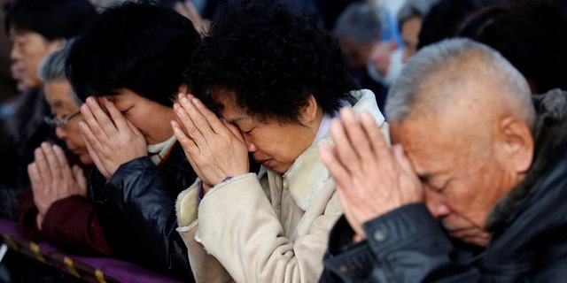 Believers take part in a weekend mass at an underground Catholic Church in Tianjin Nov. 10, 2013.