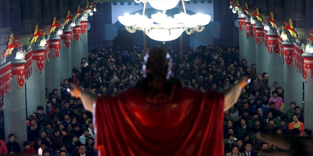 Worshippers attend an Easter mass on the eve of Easter, at a Catholic church in Shenyang, Liaoning province, April 4, 2015. Picture taken April 4, 2015. REUTERS/Stringer
CHINA OUT. NO COMMERCIAL OR EDITORIAL SALES IN CHINA - GF10000049971