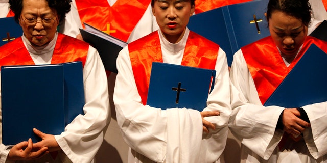 Protestants from the Nanjing Christian Church sing carols during a Christmas function in Nanjing, Jiangsu province, December 19, 2009.