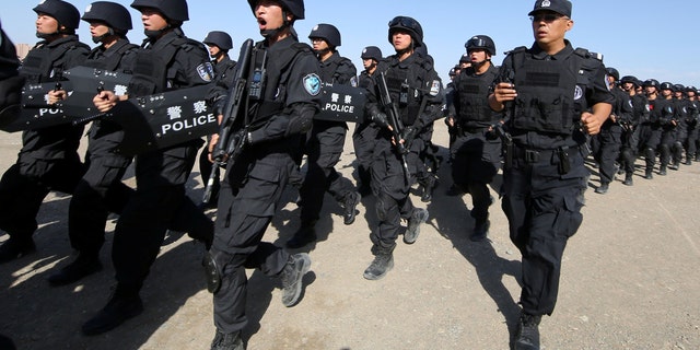 Chinese soldiers participate in a counter-terrorism drill in Hami, Xinjiang Uyghur Autonomous Region, China July 8, 2017. Picture taken July 8, 2017. REUTERS/Stringer ATTENTION EDITORS - THIS IMAGE HAS BEEN SUPPLIED BY A THIRD PARTY.  CHINA OUT.  NO COMMERCIAL OR PUBLISHING SALES IN CHINA.  -RC1F68B6C7F0