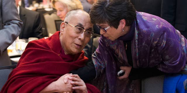Feb. 5, 2015: Valerie Jarrett, senior adviser to President Barack Obama, right, talks with the Dalai Lama during the National Prayer Breakfast in Washington.