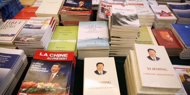 Magazines and books, featuring Chinese President Xi Jinping on the cover, are seen at the media center during the China's National People's Congress (NPC) in Beijing, March 7, 2018.