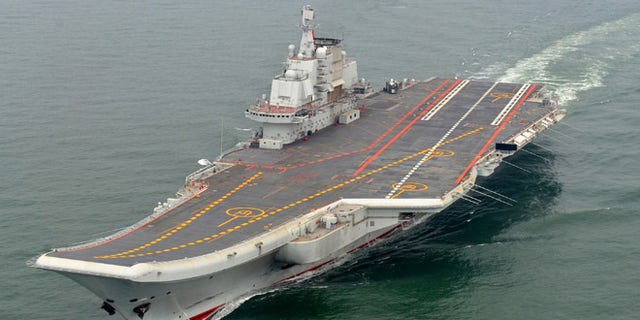 FILE: Chinese aircraft carrier Liaoning cruises for a test on the sea.