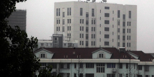 This May 31, 2013 photo shows the building housing Unit 61398 of the Peoples Liberation Army, center top, in the outskirts of Shanghai, China. After years of quiet and largely unsuccessful diplomacy, the U.S. has brought its persistent computer-hacking problems with China into the open, delivering a steady drumbeat of reports accusing Beijings government and military of computer-based attacks against America. Officials say the new strategy may be having some impact.
